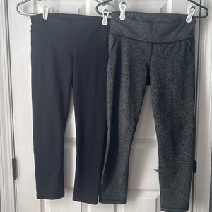 2 pair Under Armour cropped leggings black  and grey stripe- small